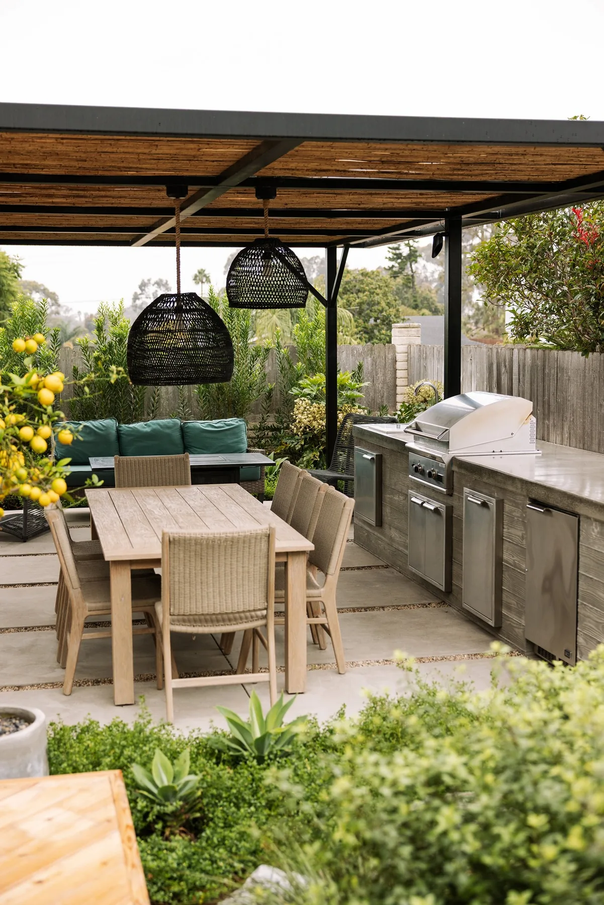 Shaded outdoor kitchen and dining area.