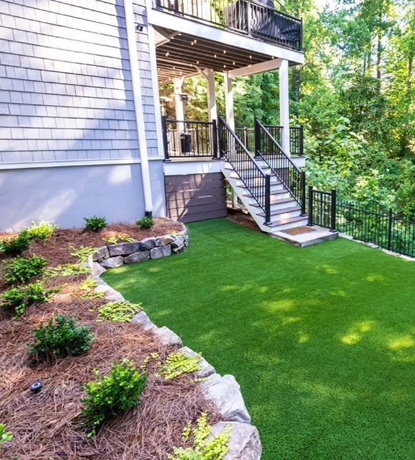 Leveled side yard with planting beside the deck.
