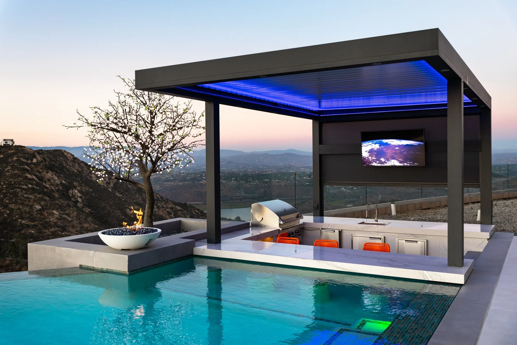 Covered bar facing the pool and distant landscape.