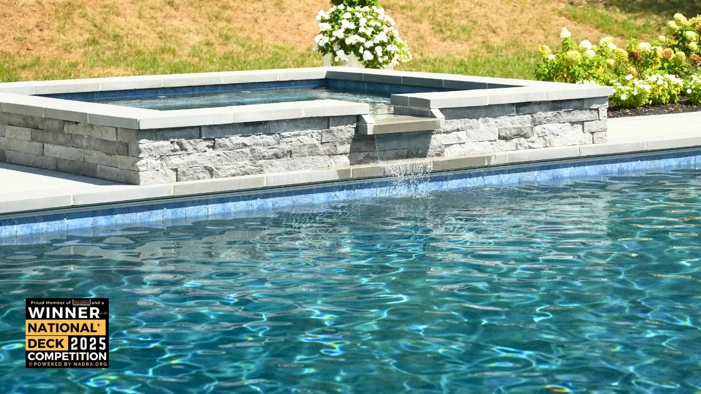 Raised spa and stone edge beside the pool.