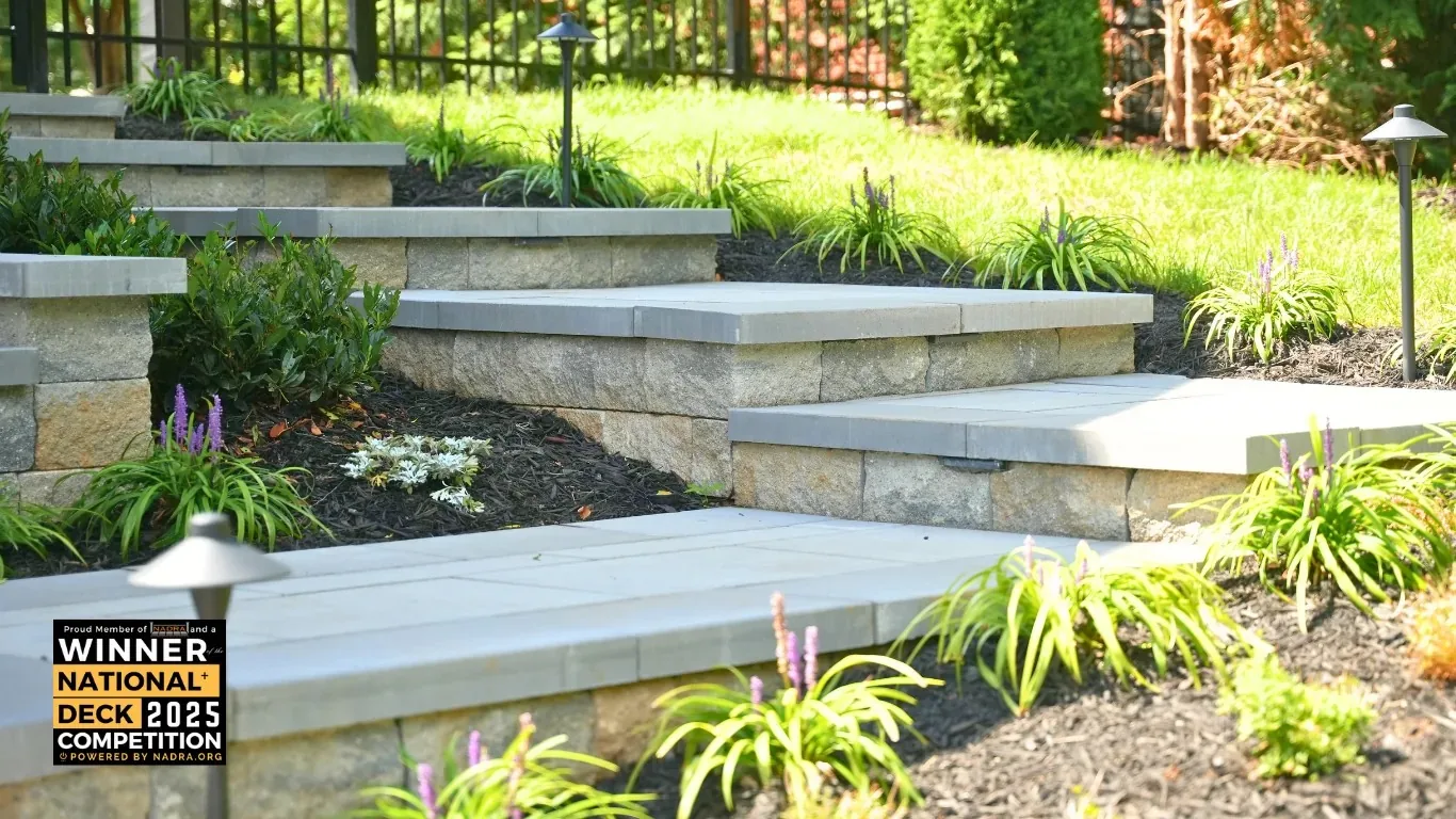 Broad steps and planting at the edge of the terrace.