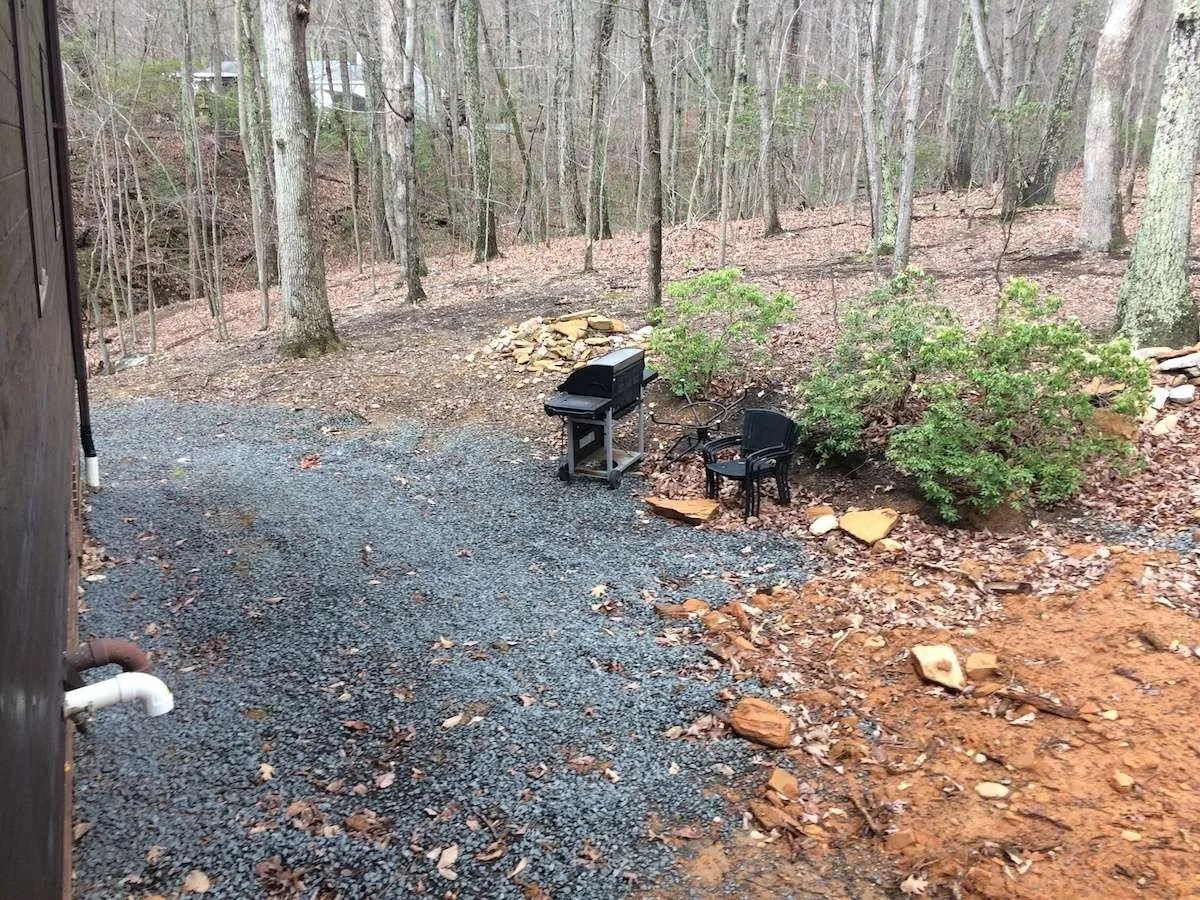 Steep wooded yard before the patio was built.
