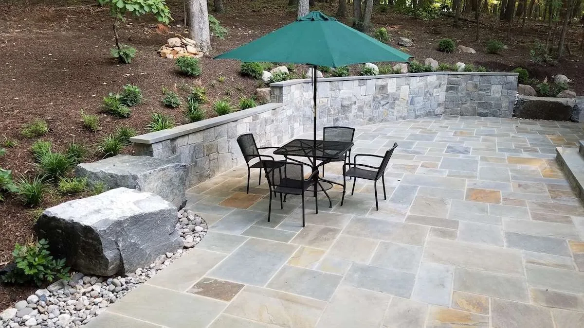 Outdoor dining table on the new stone terrace.