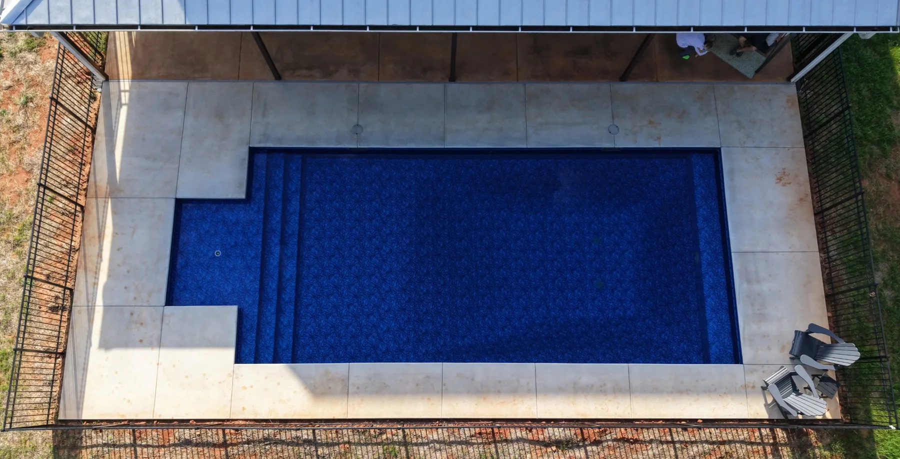 Overhead view of the pool and surrounding terrace.