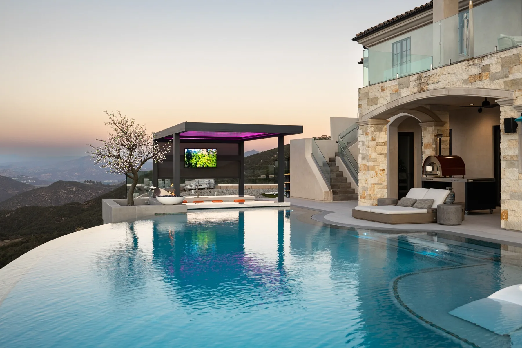 Infinity-edge pool looking toward a covered swim-up bar.