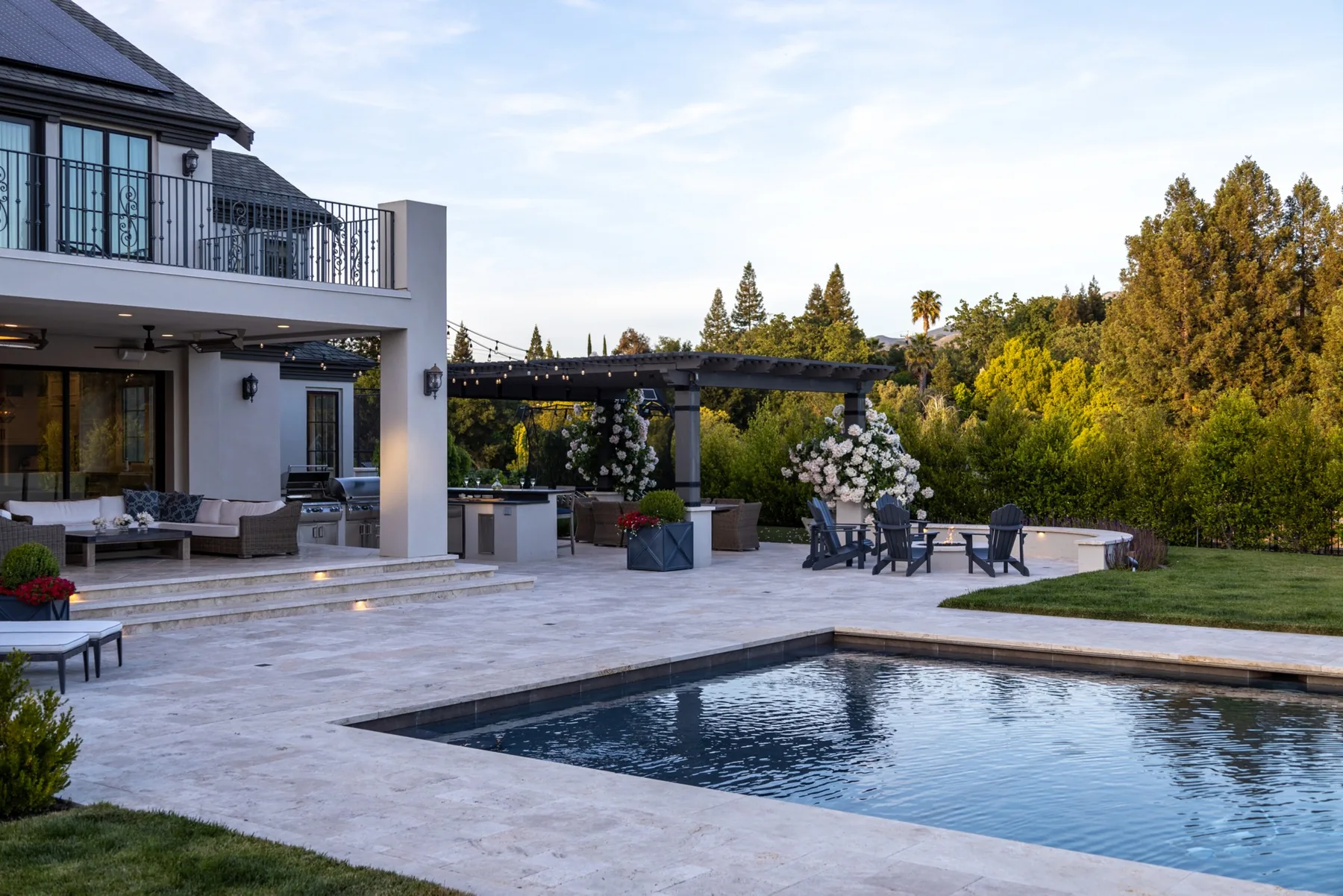 Pool and outdoor living areas beside an Alamo home.
